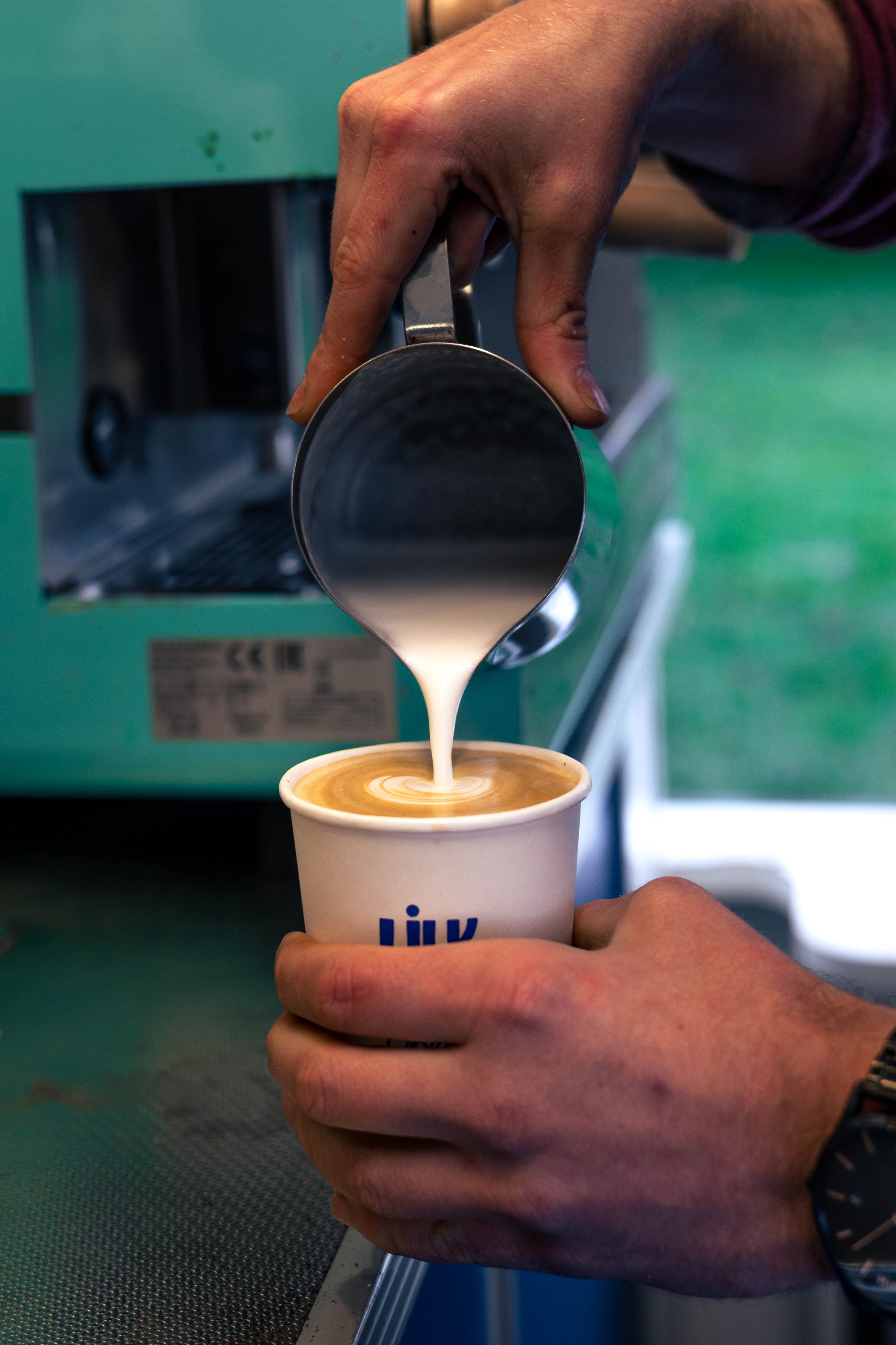 Latte Milk Being Poured On Mobile Coffee Trailer