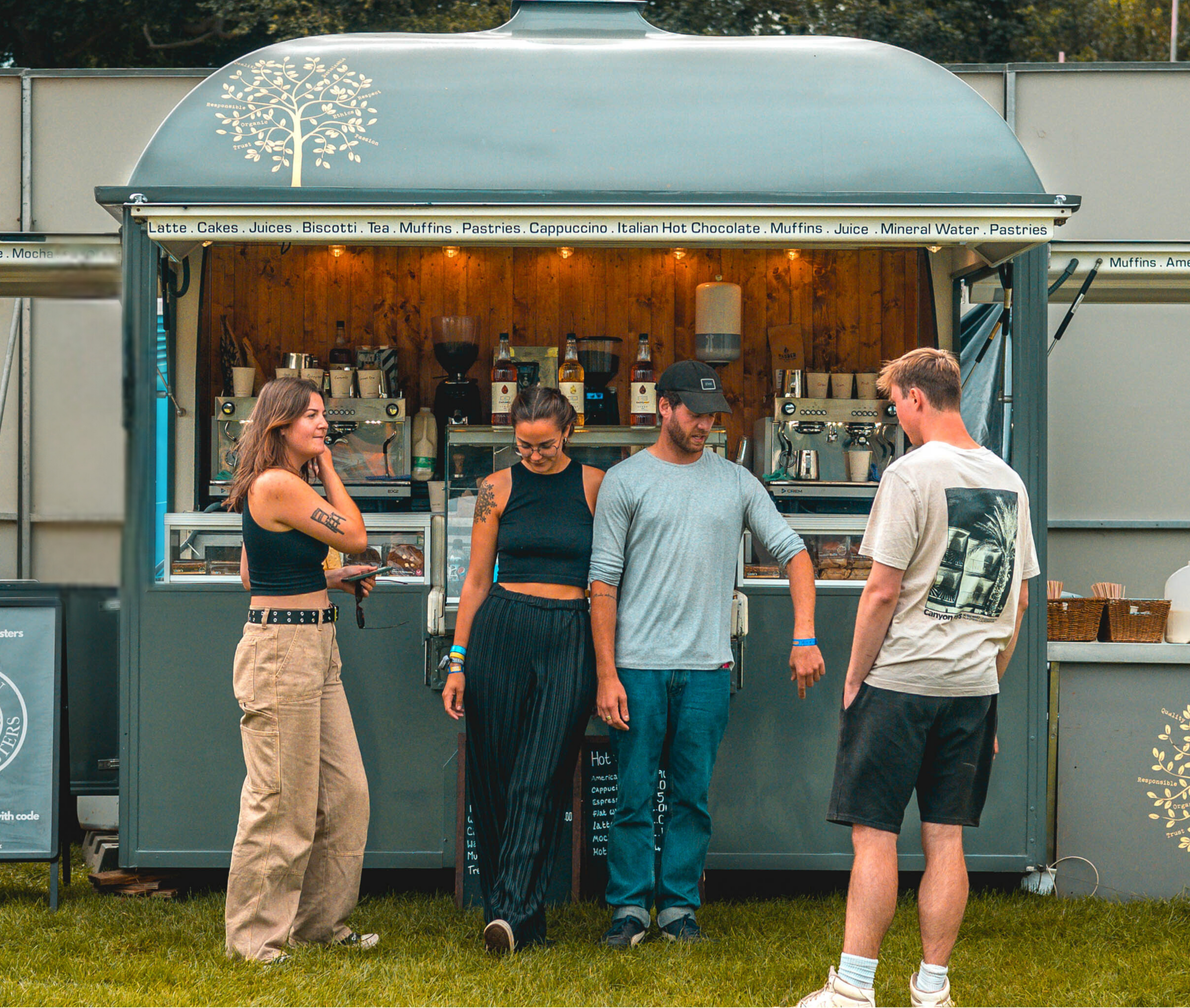 the team in front of the mobile coffee trailer